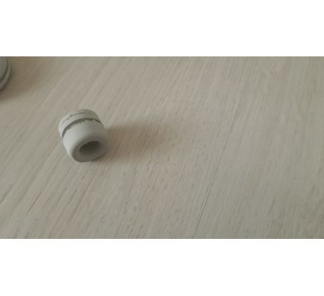 Prechodka predného krytu JAWA 50 - 05, 20, 21 (pro bowden tacho./kabel svíčky) - šedá *M